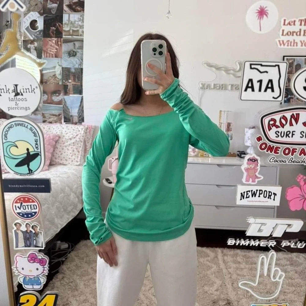 green nike off the shoulder long sleeve top